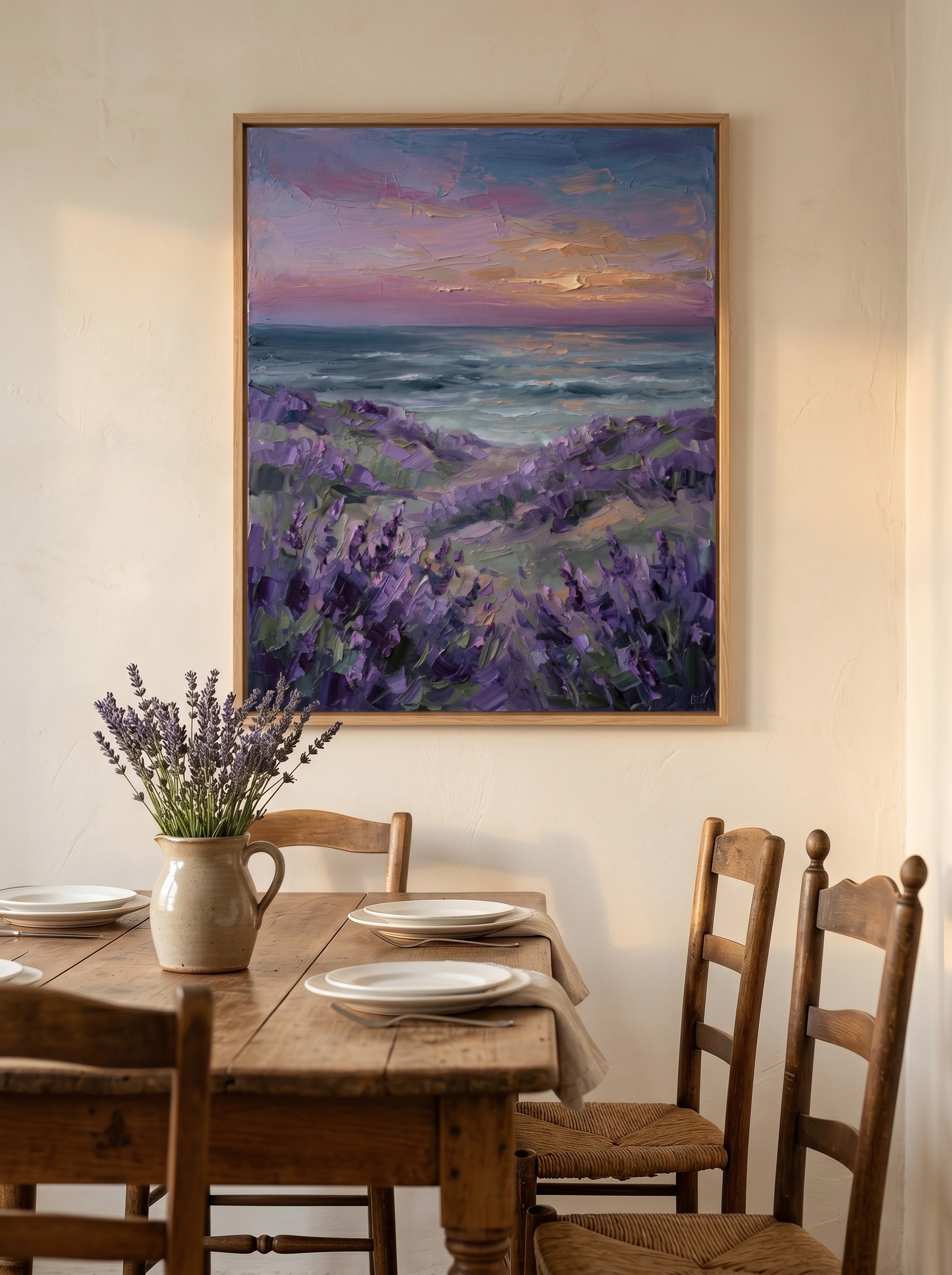 The "Twilight Lavender Shores" painting styled in a warm rustic dining room. Hung above a wooden dining table decorated with a vase of fresh lavender, creating a cozy and relaxing coastal atmosphere.