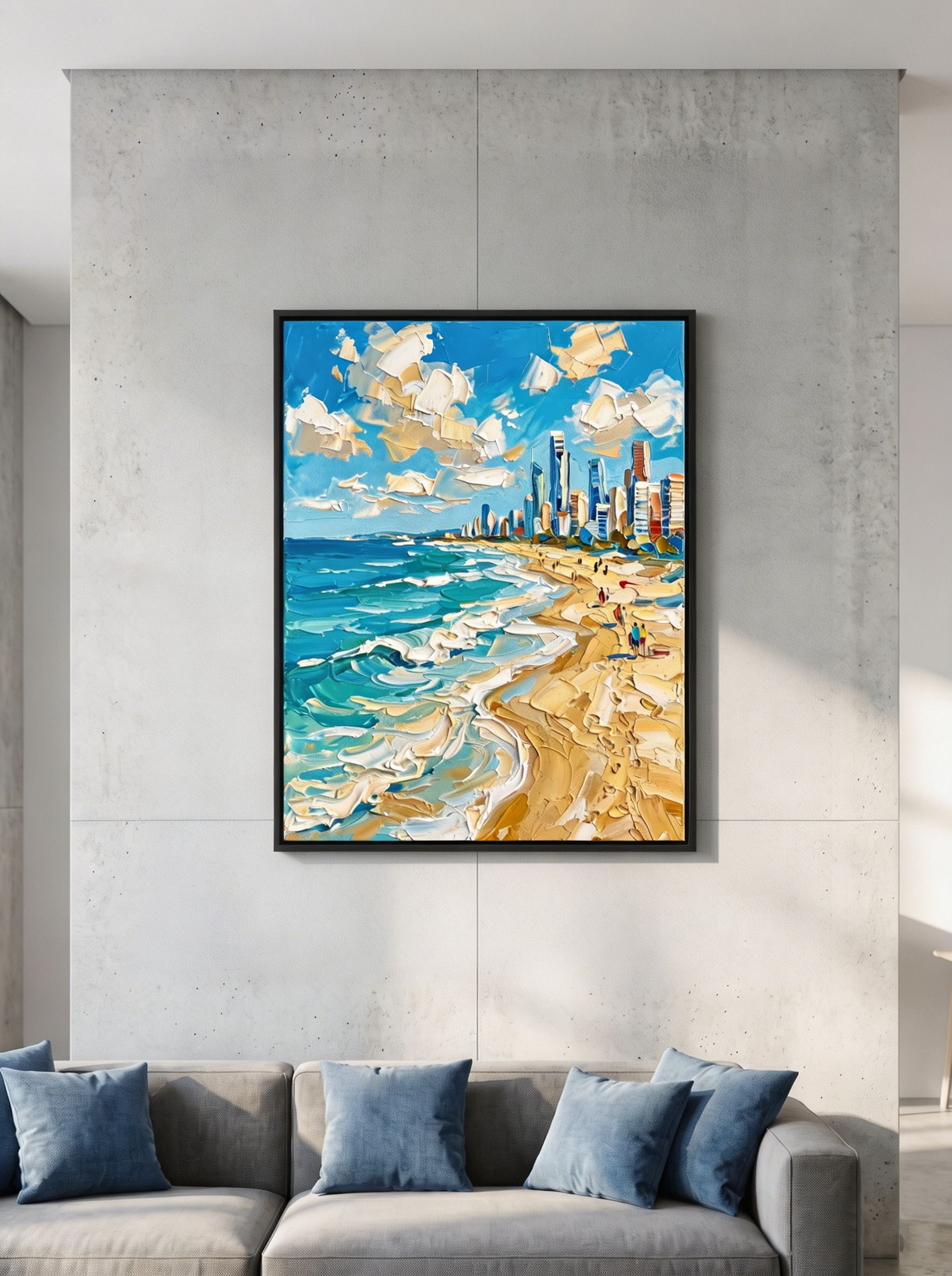 The "Golden Coast Symphony" beach skyline painting beautifully contrasting in a modern industrial living room. Hung on a minimalist grey concrete wall above a sleek grey sofa, the artwork's bright turquoise and gold colors become the dramatic focal point of the room.