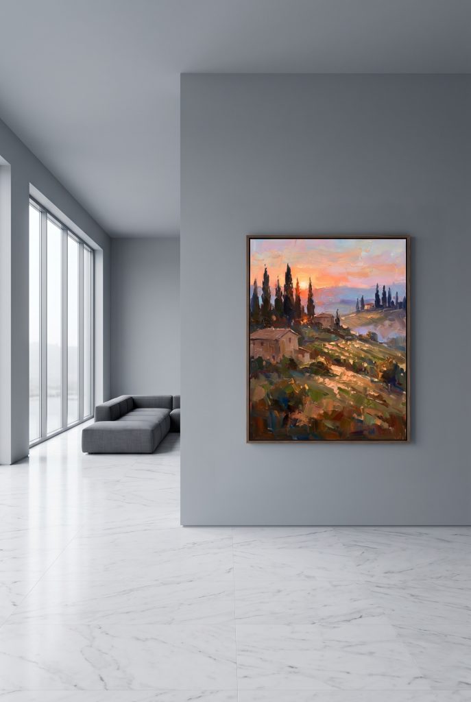 A beautiful framed sunset oil painting creating a striking warm contrast inside a sleek, cold minimalist grey living room with large windows.