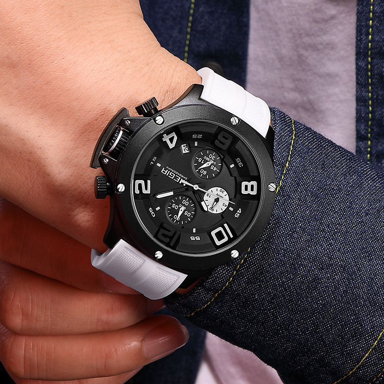 On-wrist view of MEGIR men's sport watch with white silicone strap and denim shirt outfit.